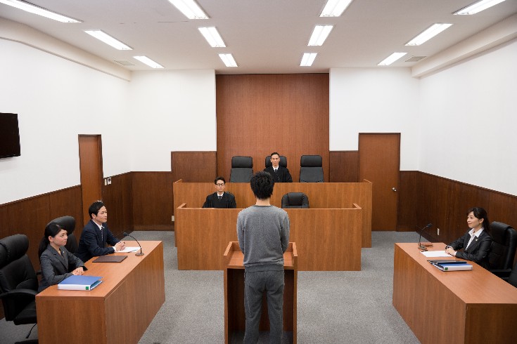 裁判になった段階
